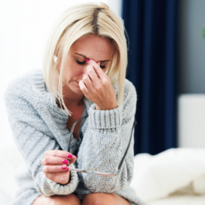 Person clutching chest and looking distressed, symbolizing severe withdrawal symptoms