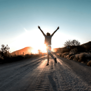 Woman looking hopeful at sunrise representing new beginnings in recovery