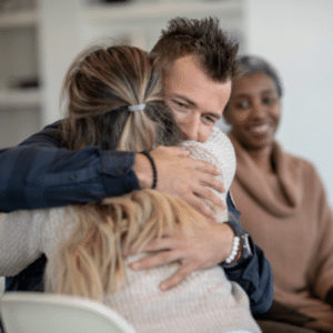 A supportive therapy group discussing recovery steps
